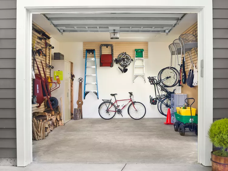 Open garage with equipment and storage